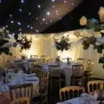 Party marquee with star cloth and uplights